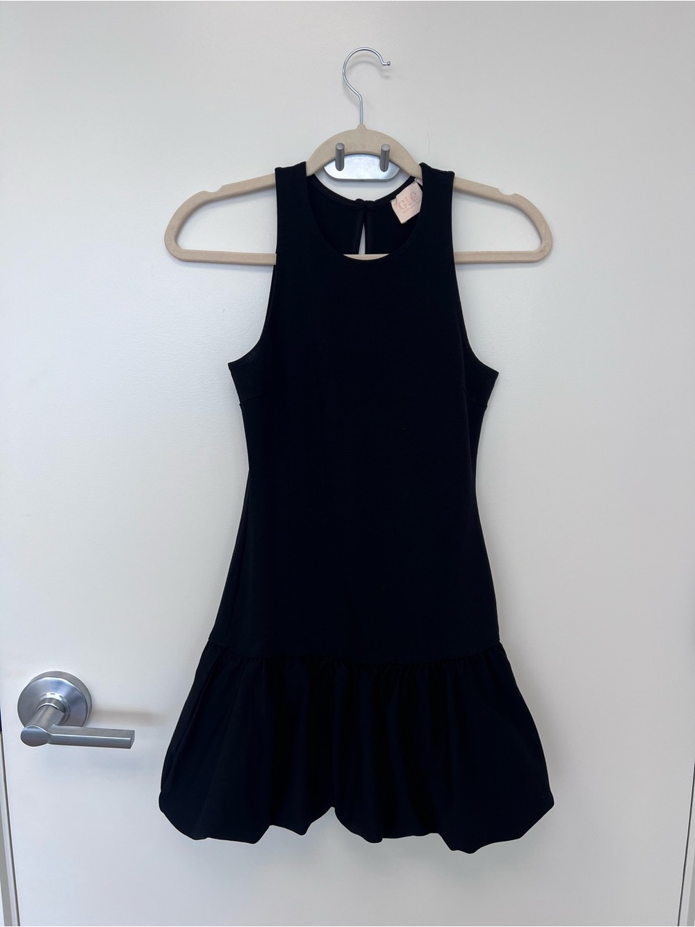 Good Luck Gem Black Sleeveless Mini Dress with Flounce Hem